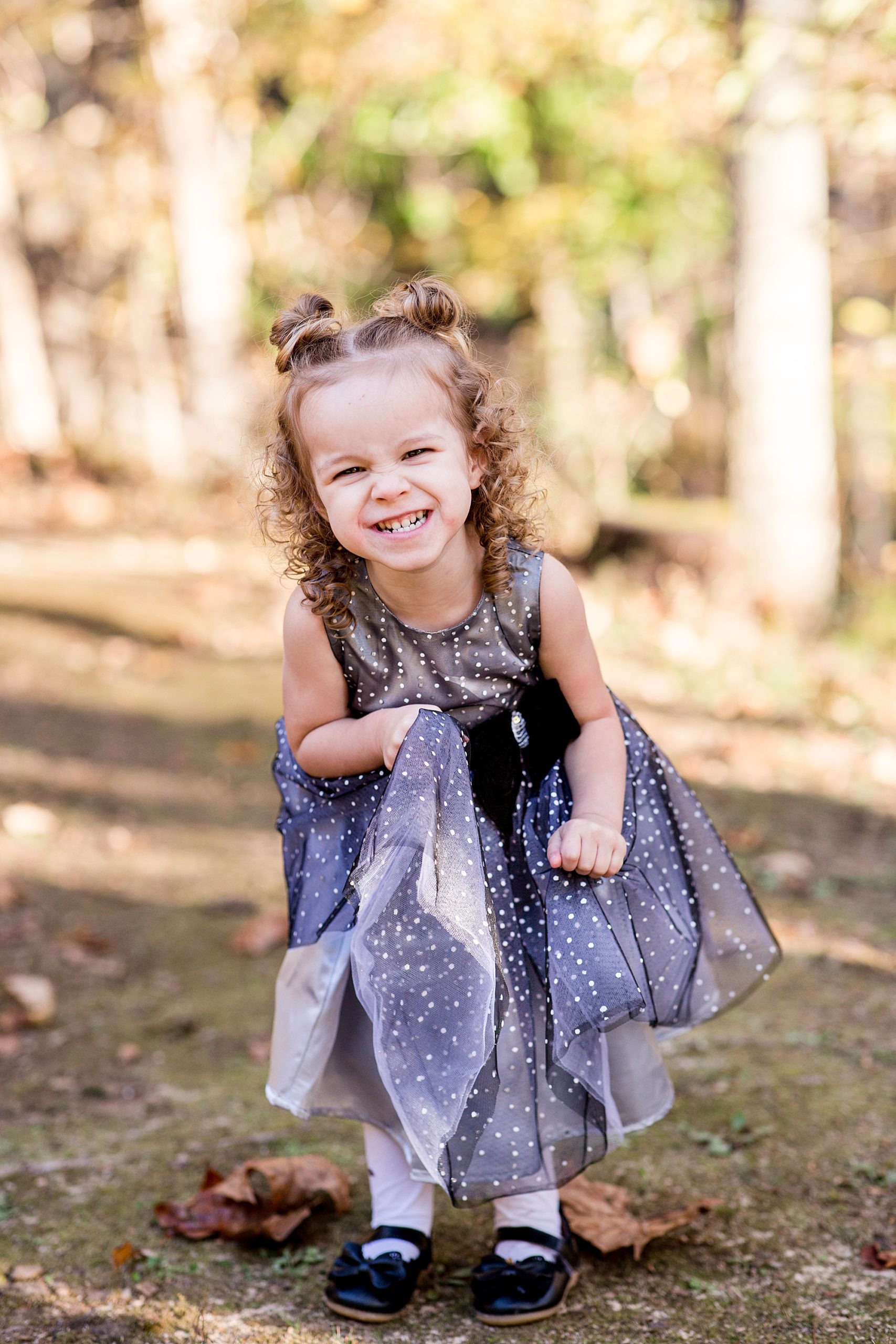 toddler laughs during family portraits at Montgomery Bell State Park