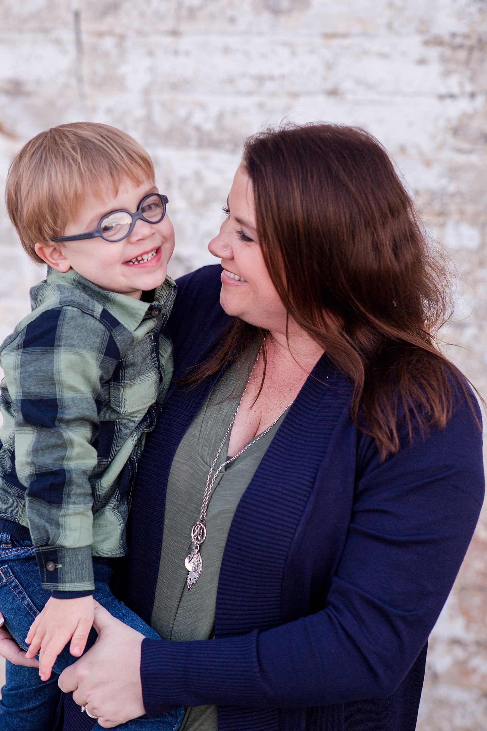 mom and son hug during family photos in Franklin TN