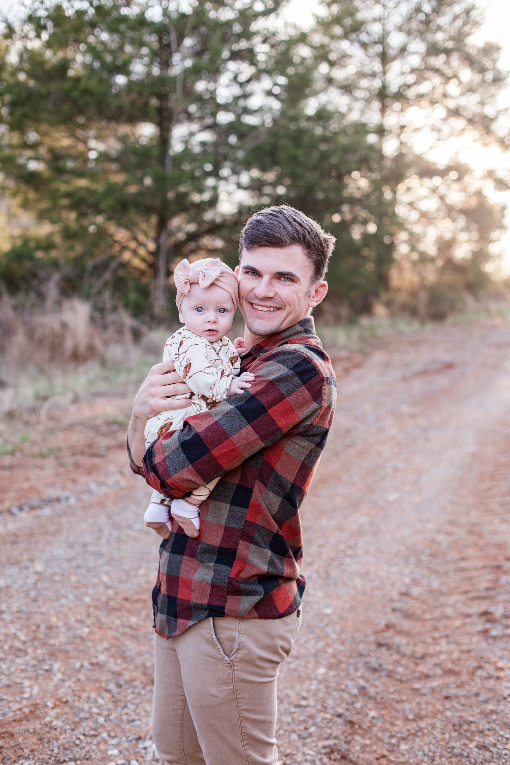 dad holds baby girl during Family Portraits in Tennessee 