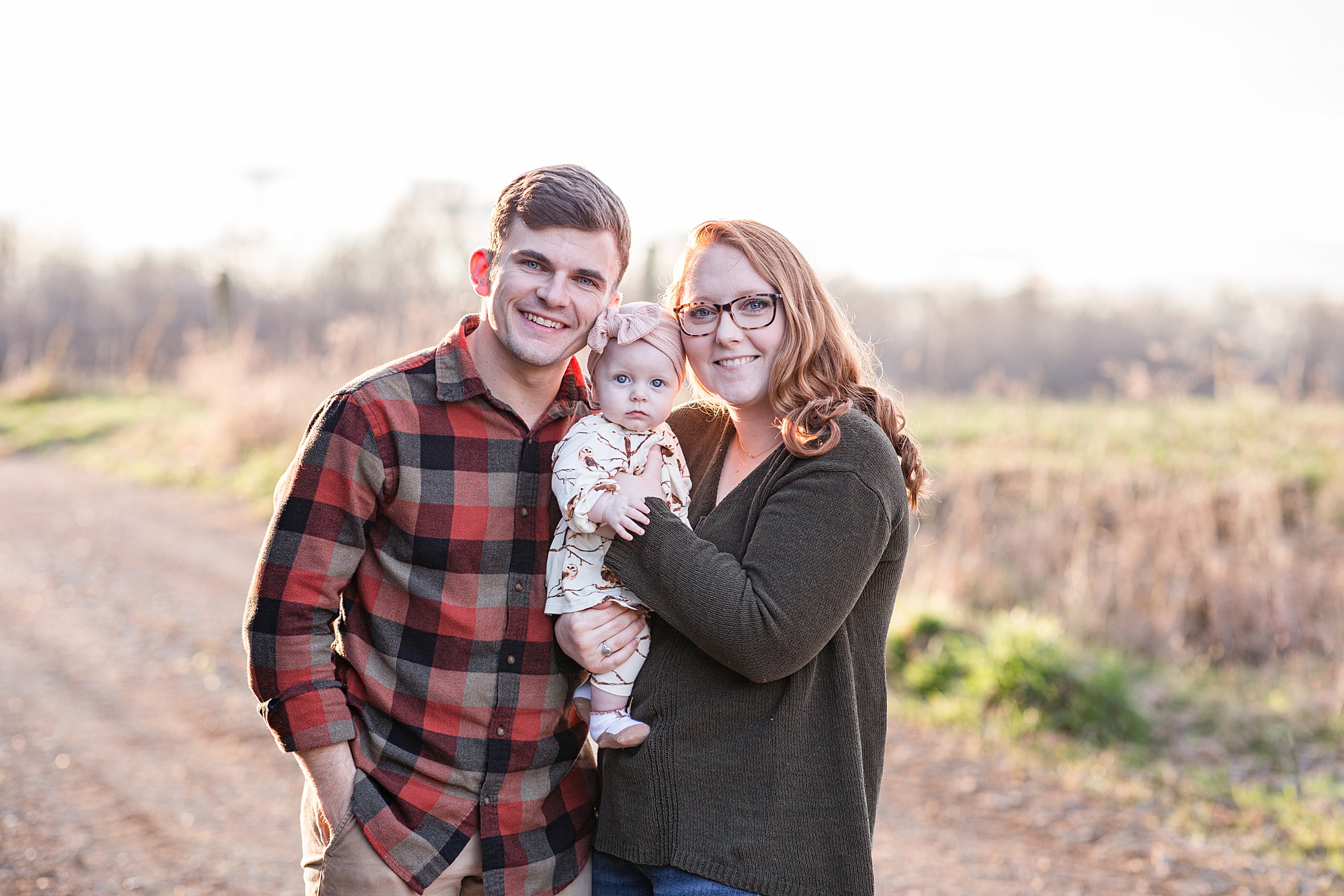 husband and wife pose with baby during Family Portraits in Tennessee 