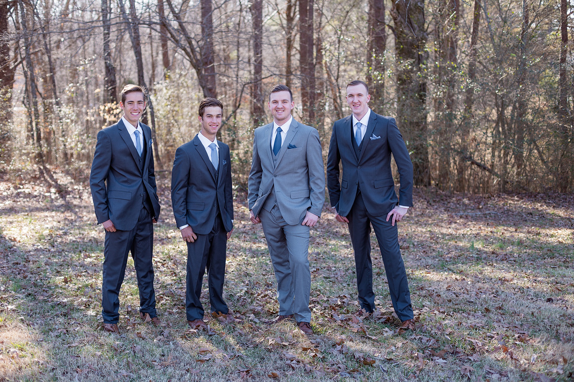groom and groomsmen pose together before winter wedding in Middle Tennessee