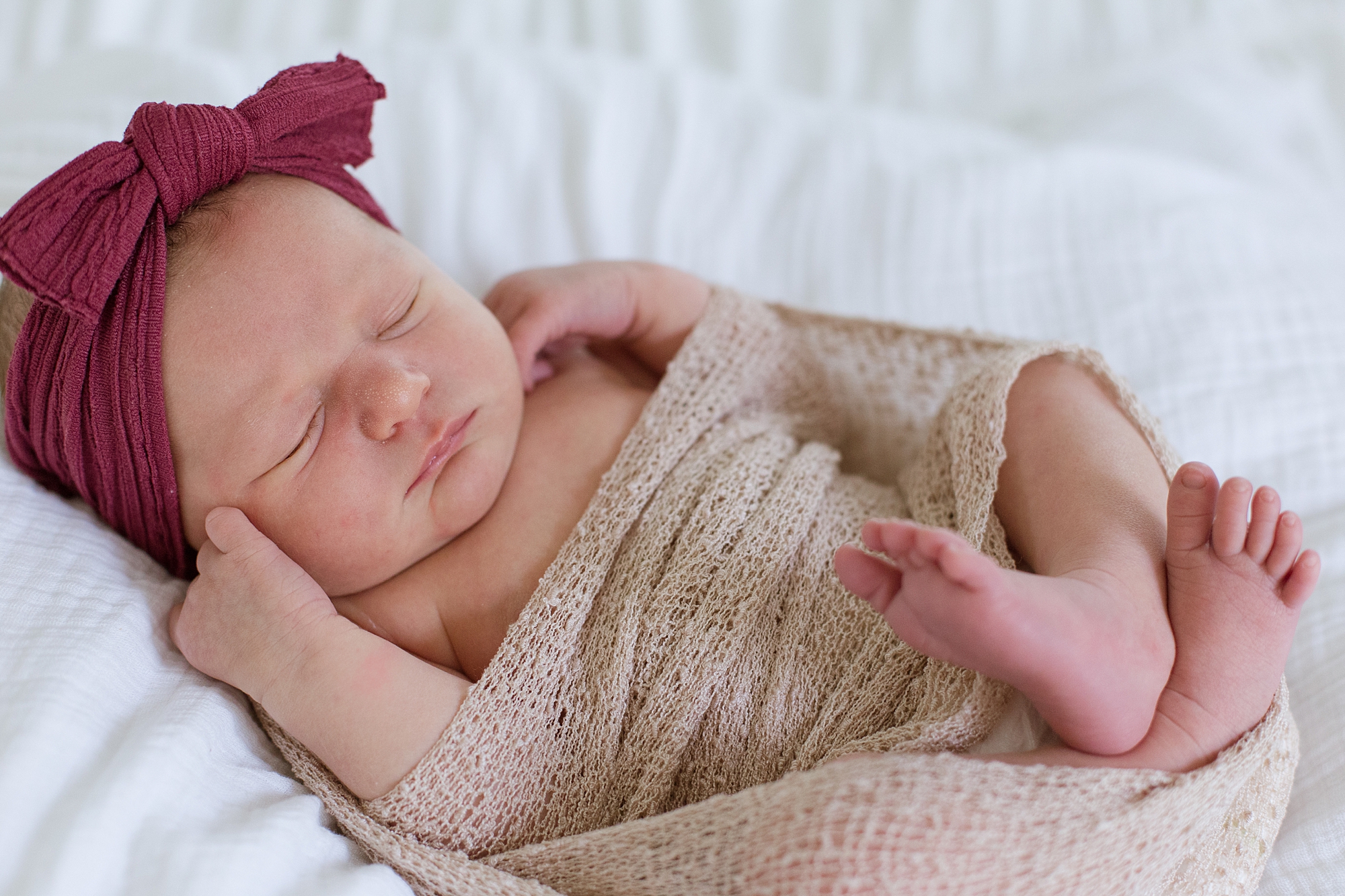 baby in tan blanket sleeps during TN newborn photos at home